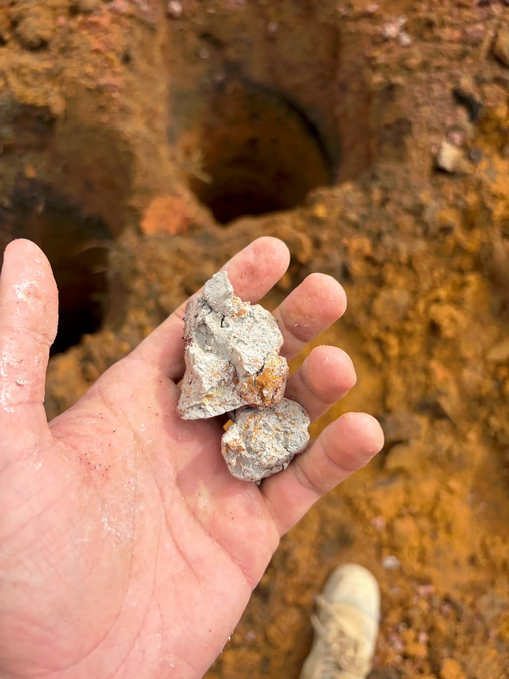 Reactive clay lifted from a fresh borehole, held in the engineer’s hand