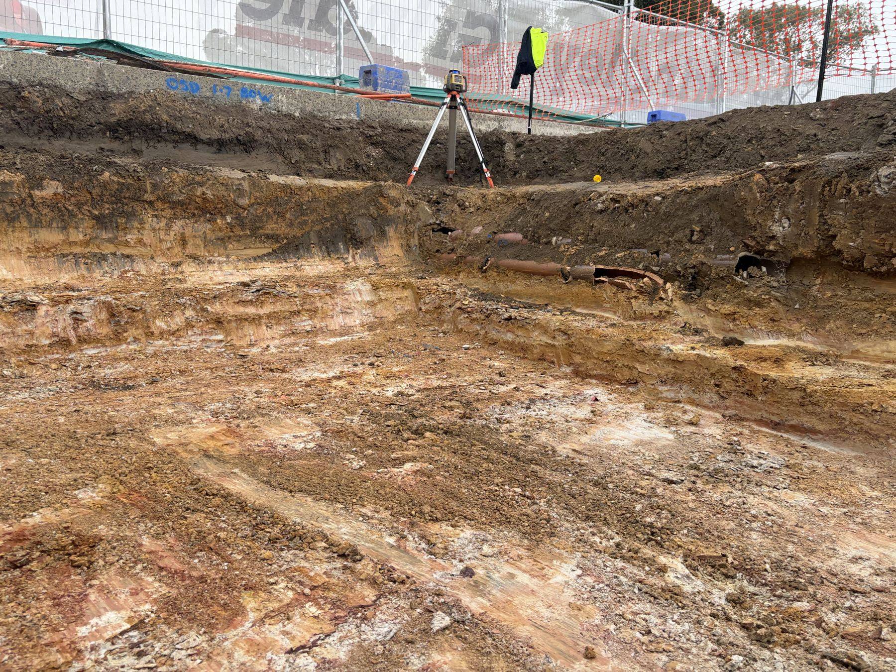 The detention tank excavation at the church expansion, laser level set up over the exposed weathered shale base