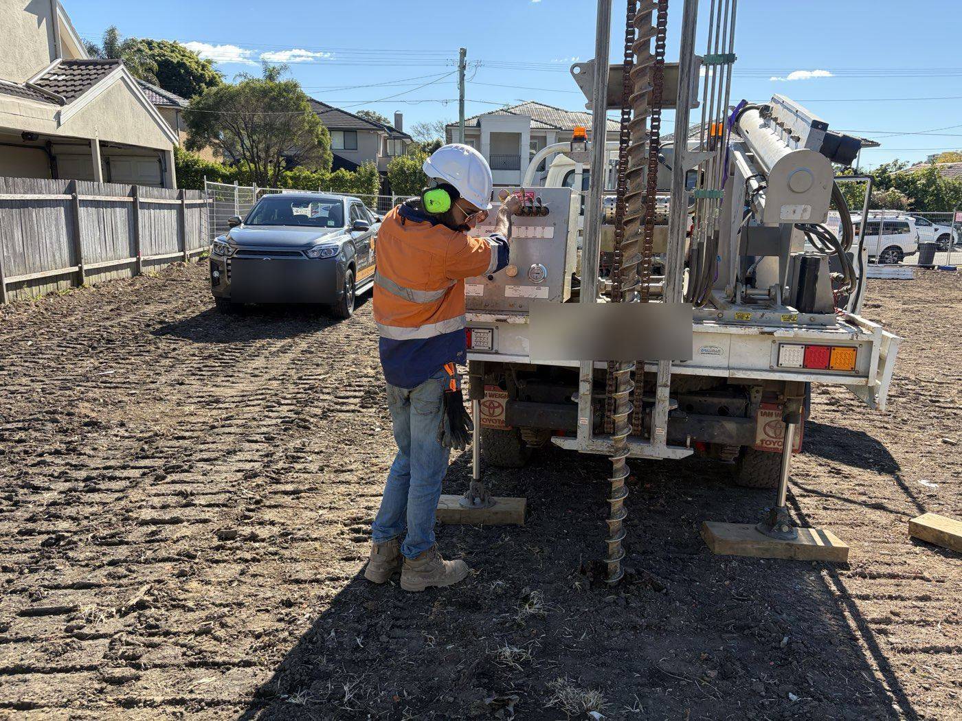Operator at the controls of the SFGEO drill rig on a Sydney site
