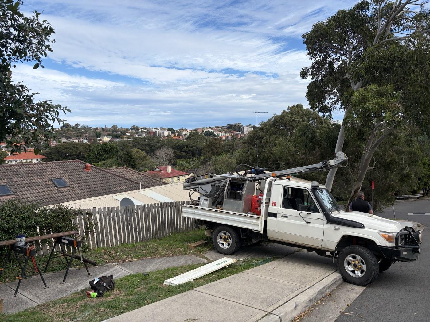 Drilling from the road verge above a steep Coogee allotment