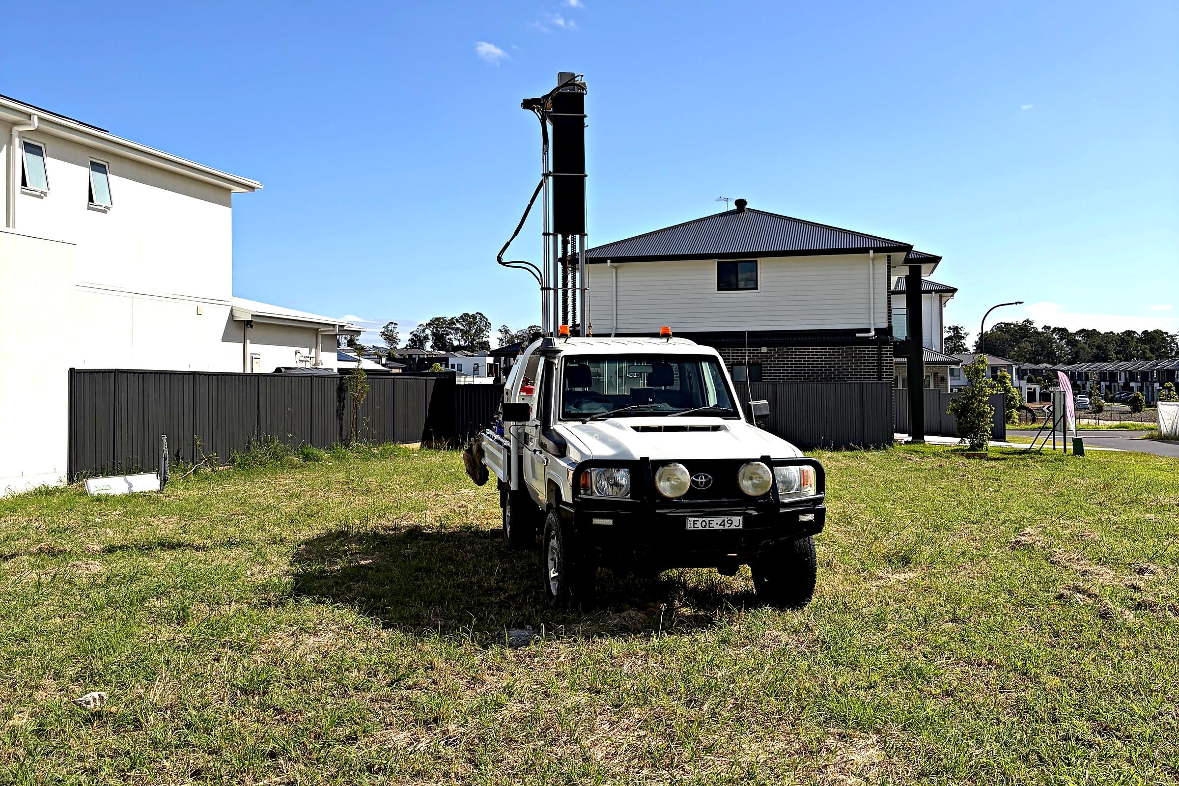 SFGEO 4WD-mounted geotechnical drill rig set up on an open residential block in Sydney